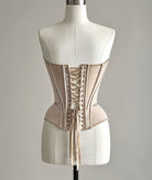 PETRA KARA architectural corset with structured design, visible boning, and intricate detailing on black fabric.