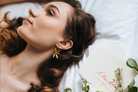 Golden orchid drop earrings by PM Atelier featuring modern floral design, perfect for bridal or elegant occasions.