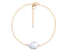 A single gold Alyssa Keishi Pearl bracelet by PM Atelier featuring elegant white pearls on a delicate chain.