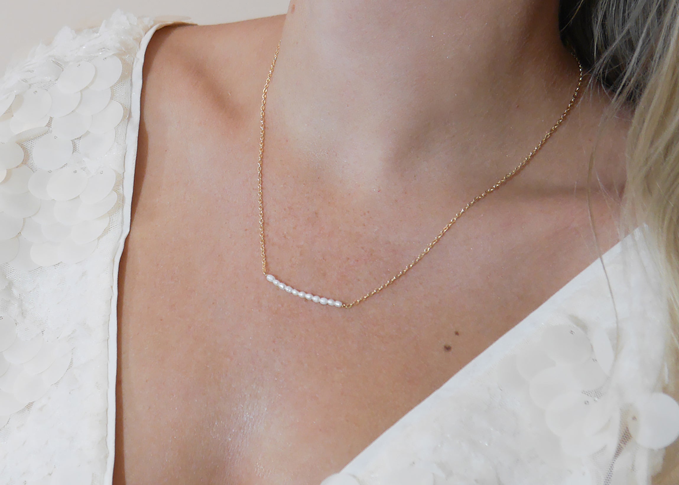 Gold Daphne Necklace by PM Atelier featuring delicate chain and elegant pendant, displayed on a neutral background