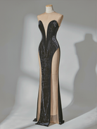 PETRA KARA Aelia lace gown in black featuring intricate lace details and a flowing, elegant silhouette.