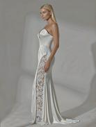 Petra Kara Aelia lace gown featuring intricate floral lace details and a flowing silhouette for elegant occasions.